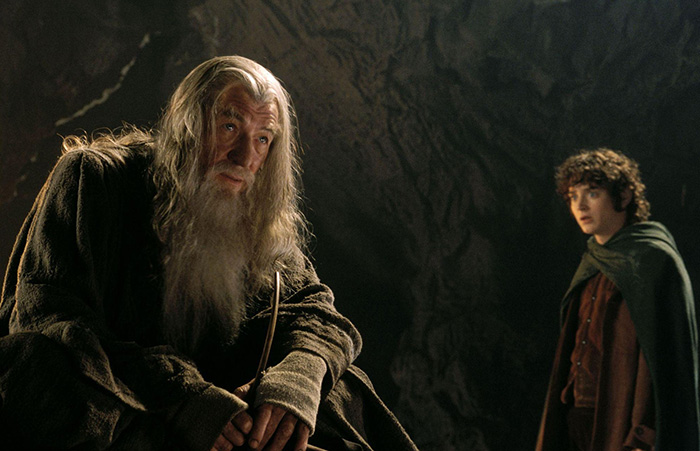 In LOTR: The Fellowship of the Ring (2001), three of the Dwarf Lords are  played by members of WETA Workshop, the SFX company who worked on the  trilogy. Full details in comments. 